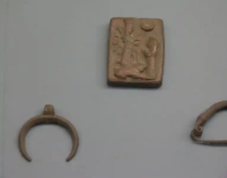 Solar symbol and crescent on a piece of clay